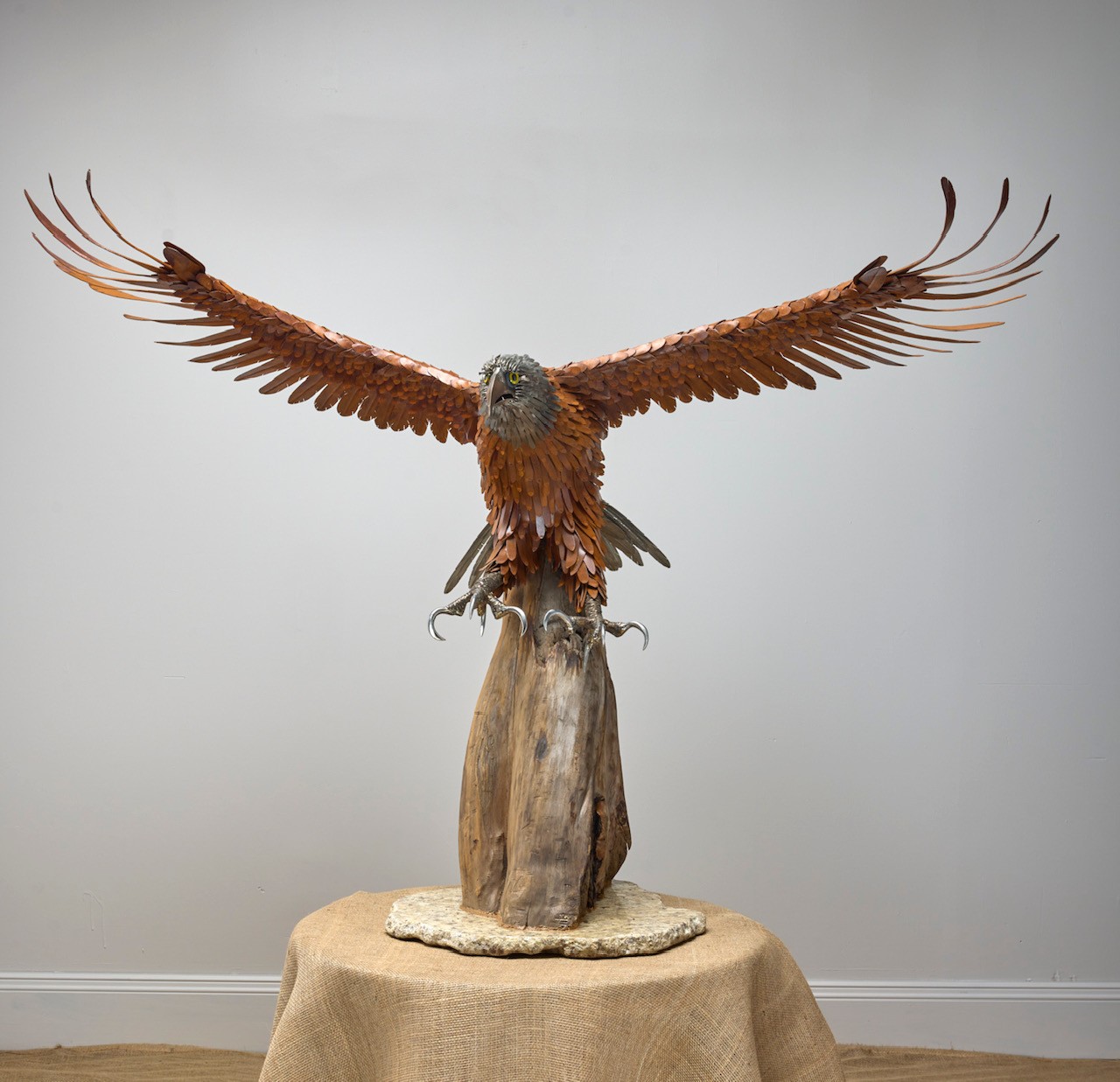 Metal eagle sculpture, front view, wings spread