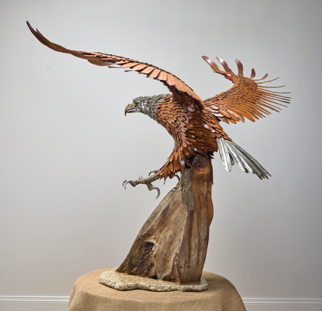 Metal eagle sculpture, three-quarter view
