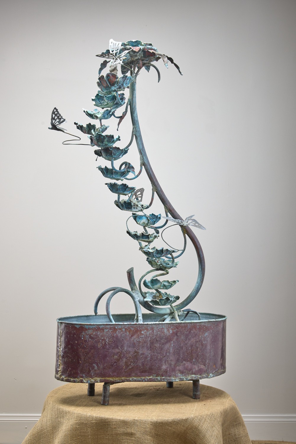Verdigris vine fountain with butterflies